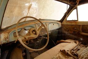 Steering wheel in the cabin of an old Renault car