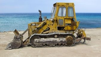 bulldozer catepillar on the beach