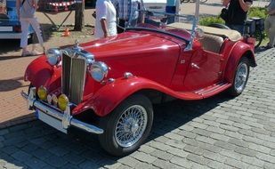 red retro convertible on the street