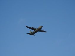 military aircraft in the blue sky