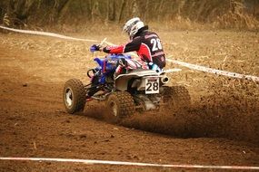 motocross on ATVs among the dust