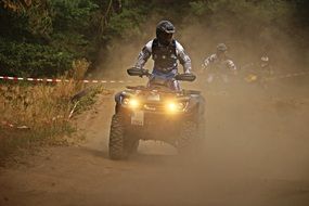 motocross on ATVs with headlights