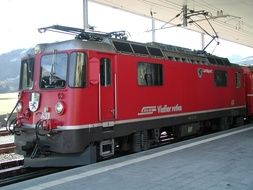 red train on the railway in Switzerland