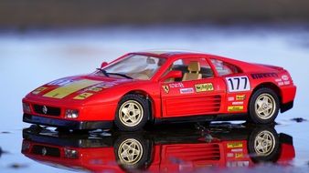 mirror reflection of a red racing car model