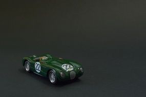 miniature model of a green vintage racing car