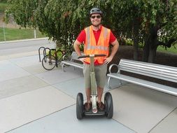 picture of the man is riding on a Segway