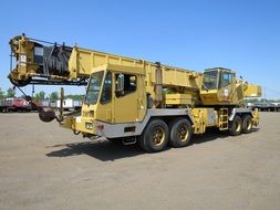 yellow construction crane under the bright sun