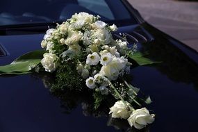 Beautiful flowers on wedding on the car