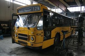 old yellow bus in a garage in the Netherlands