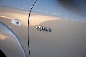 silver logo on a car close-up