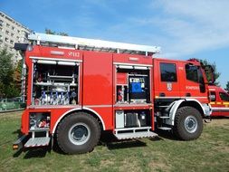fire truck stands in a green meadow