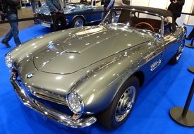 silver vintage car at a exhibition