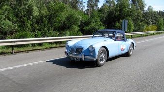 blue retro car on road