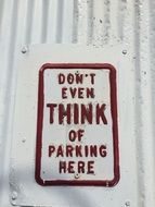 Parking sign on the wall
