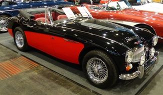 red-black classic car at a exhibition