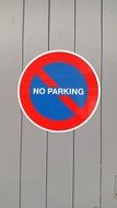 sign prohibiting parking on wooden boards