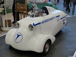 white futuristic retro car on the exhibition