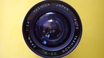 Wide-angle camera on a yellow background