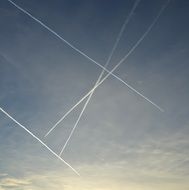 Traces of airplanes in the evening sky