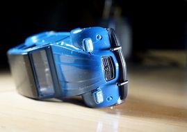 closeup picture of inverted blue toy car