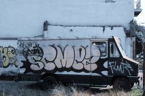 Graffiti on Old Truck and on wall