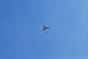 Airplane in the blue clear sky