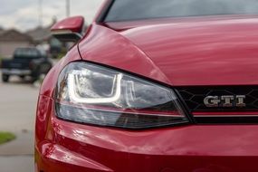 photo of the front of a red GTI car