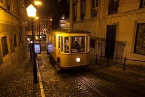 tram travels through the evening Lisbon, Portugal