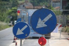 Two road signs on the road