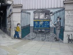 Street Art tram leaves the gate drawing