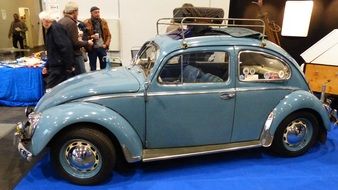 blue Volkswagen beetle on a exhibition