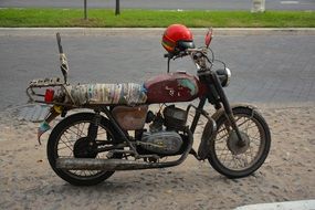 Old Motorcycle and red helmet