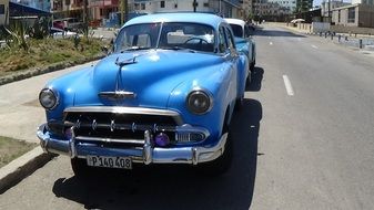 blue Retro Car parked in city, cuba, Havana