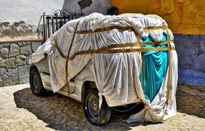 covered car near the building