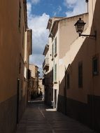 narrow street with shadows and light in Alcudia
