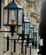 street lighting in the form of lanterns on the facade of the building