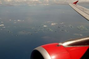 view from a window of the engine and wing of a aircraft