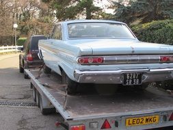 Broken car on a trailer