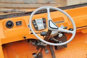 orange panel with instruments in the car