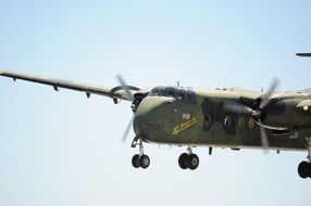 green military Plane in flight