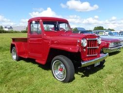 trucks and other cars at a exhibition in the open air