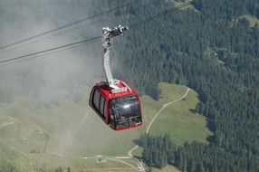 red Cable Car over a picturesque landscape