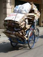 cyclist like a garbage man on a street of vietnam
