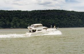 yacht speeding on the river