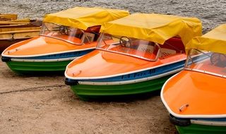 orange Boats on a shore of sea
