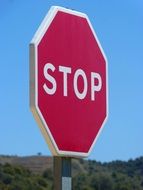 red stop sign on a blue sky background