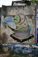 graffiti on the wall in the form of an alien