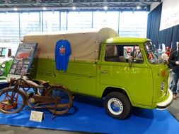 old green mini van on an exhibition