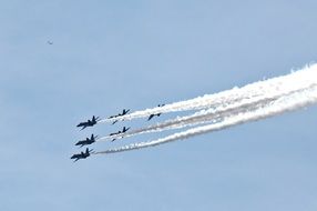 airplanes in the sky at an air show