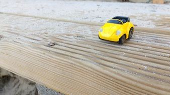 small yellow Toy Car